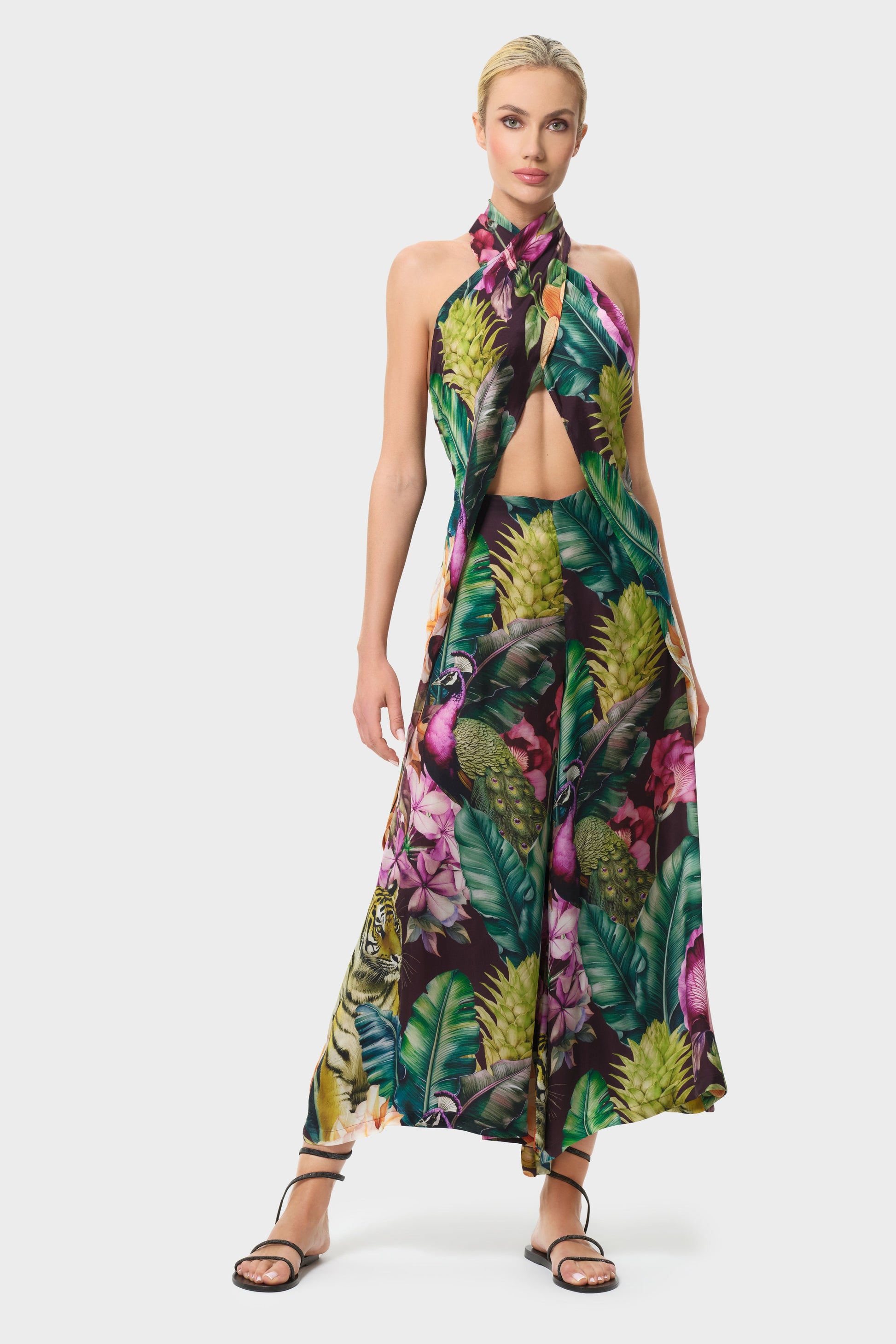 Woman wearing a colorful patterned outfit on a white background