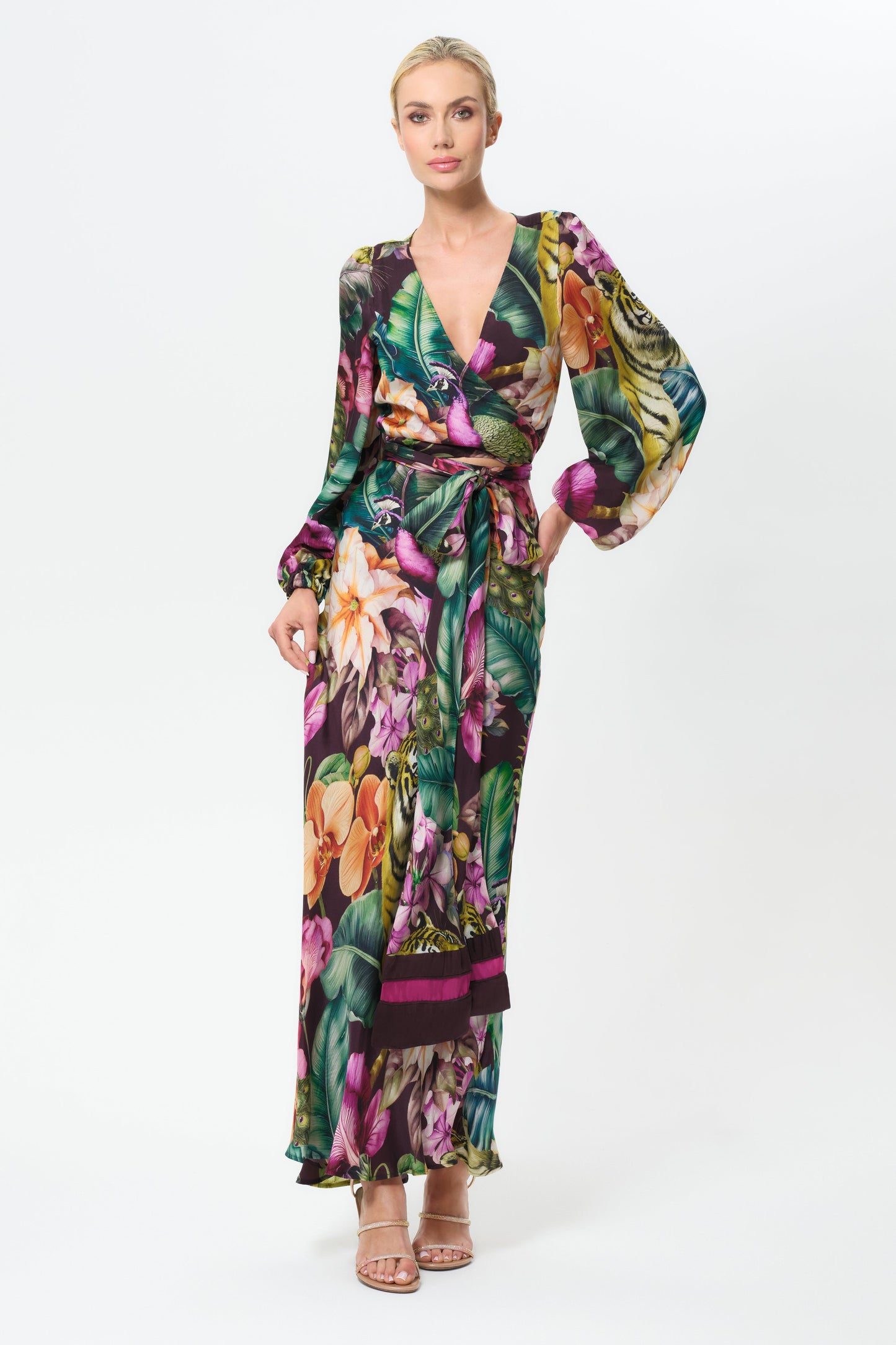 Woman wearing a colorful floral outfit on a white background