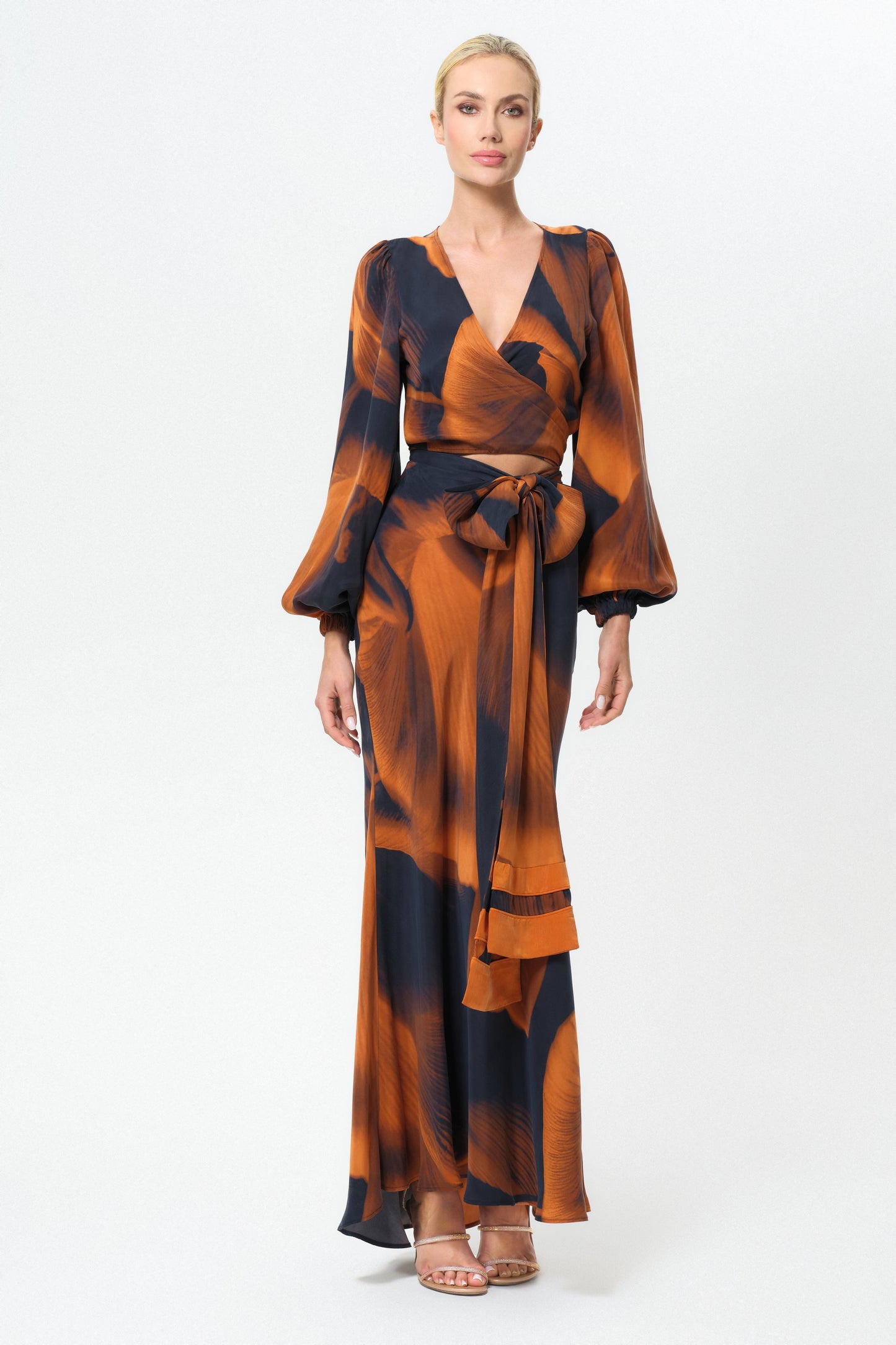 Woman wearing an orange and black skirt on a white background