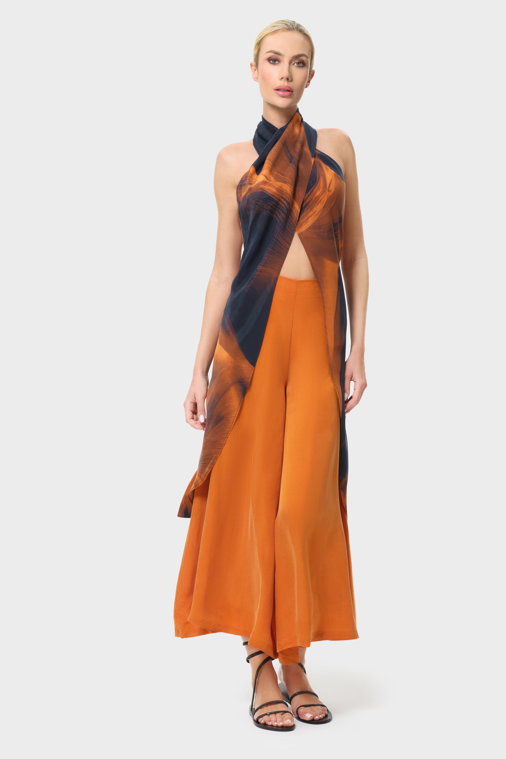 Woman wearing an orange outfit on a white background