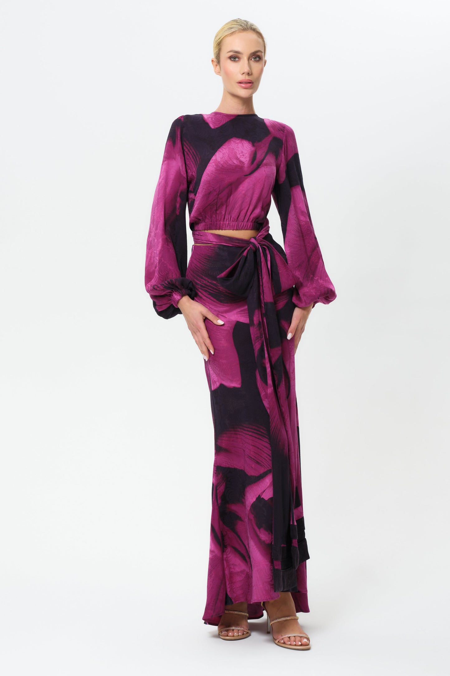 Woman wearing a pink and black skirt on a white background