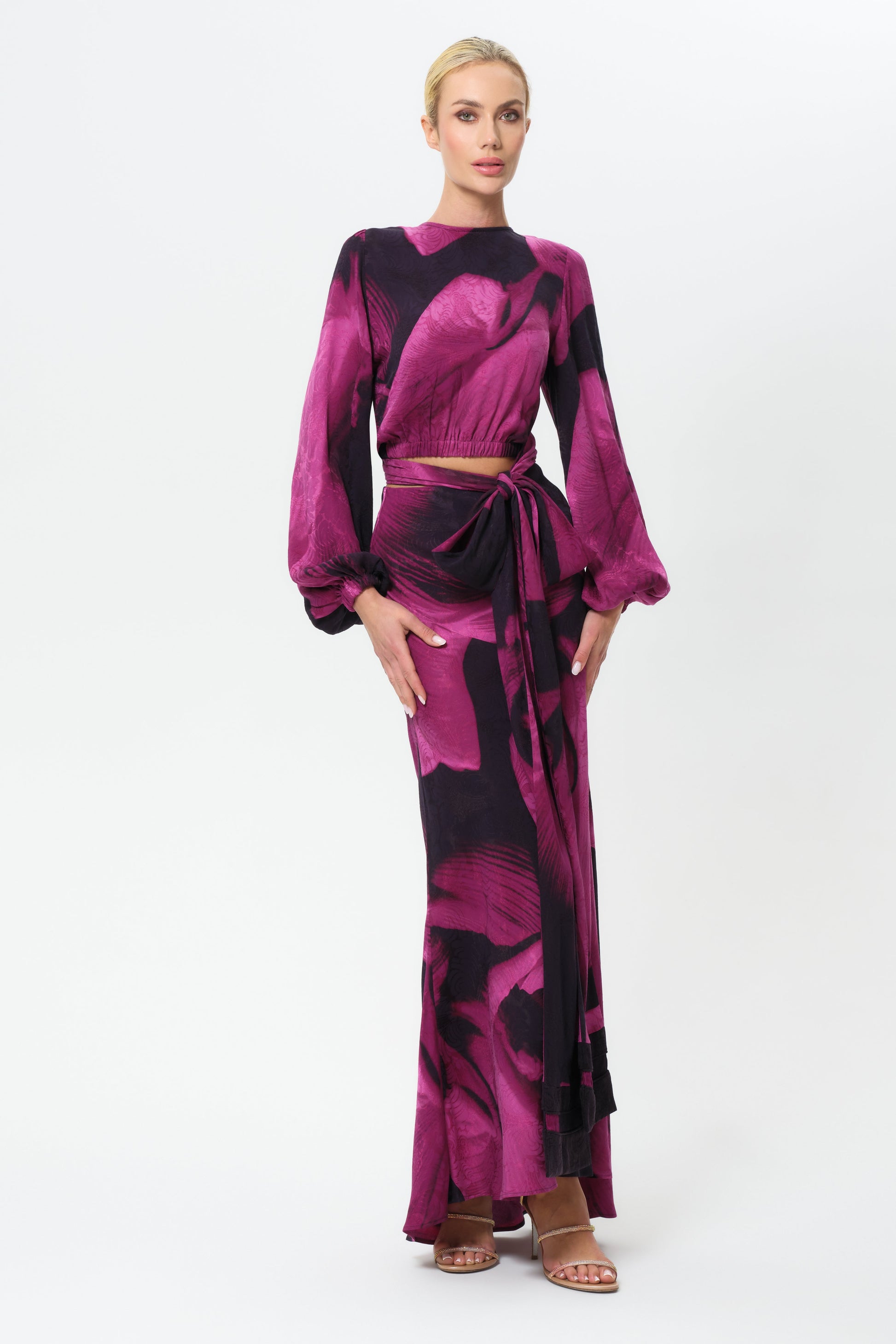 Woman wearing a pink and black skirt on a white background